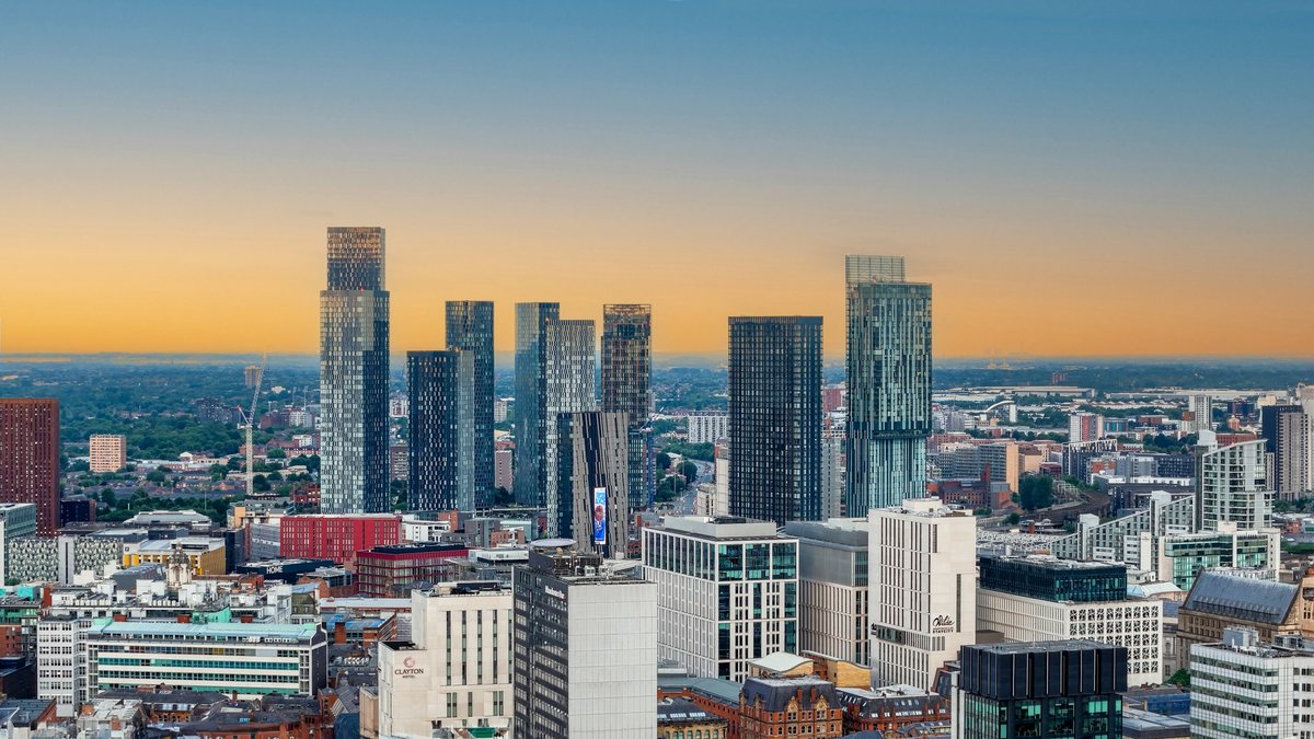 Manchester city skyline at sunrise for a low-cost city date