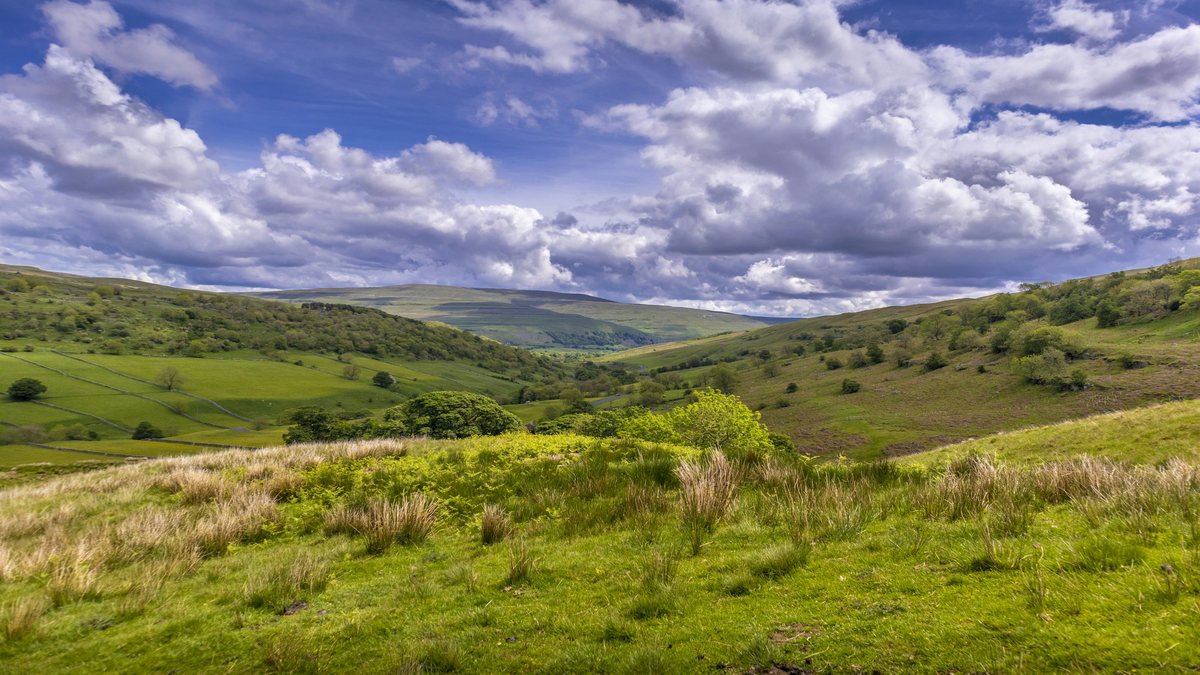 Rolling green hills in the Yorkshire Dales on a couples weekend break